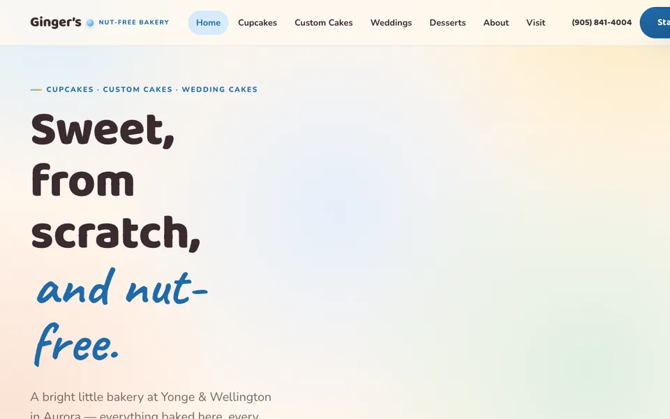 The Ginger's Cupcakes homepage: a warm cream page with rounded baby-blue and gold lettering.