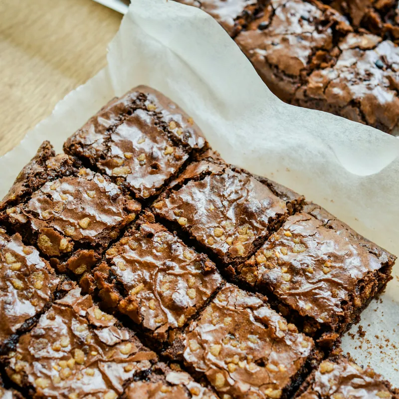 Chocolate brownie squares cut in the baking tray