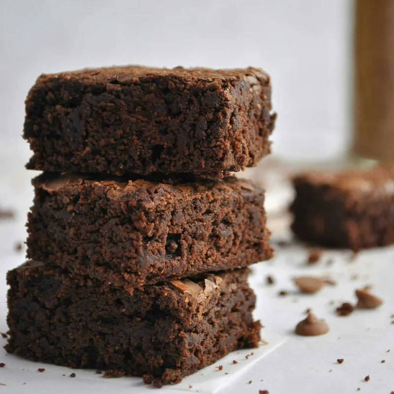 A stack of three fudgy brownies