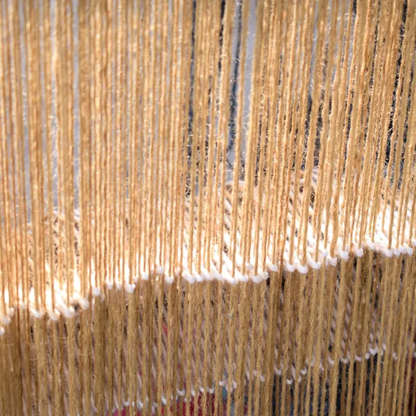 Close-up of hanging natural-fibre threads